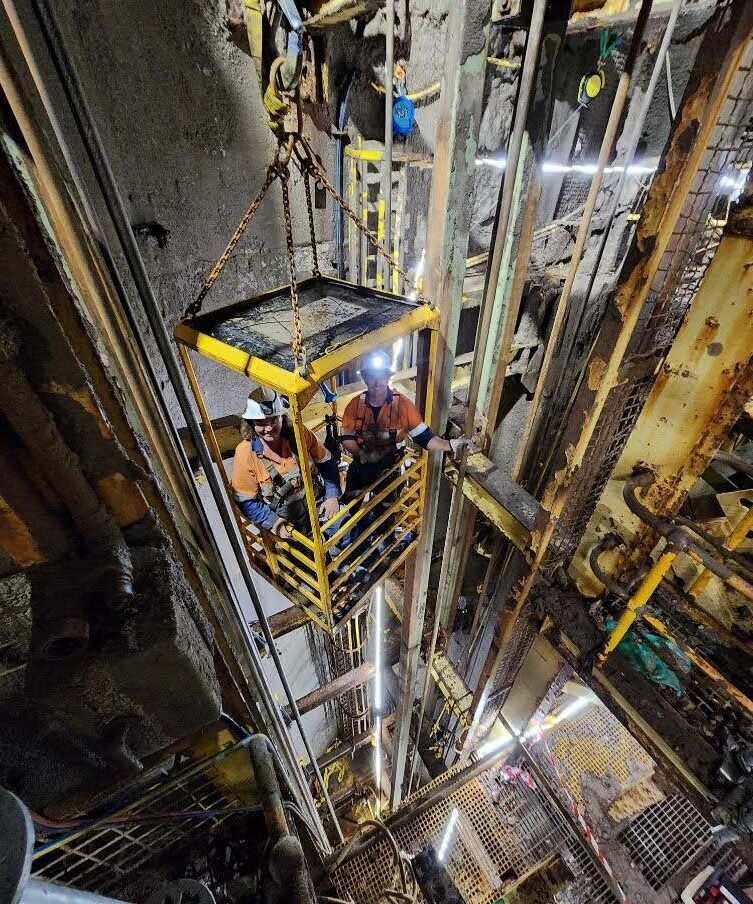 a group of mine workers in a lift - Shaft Steel Replacement