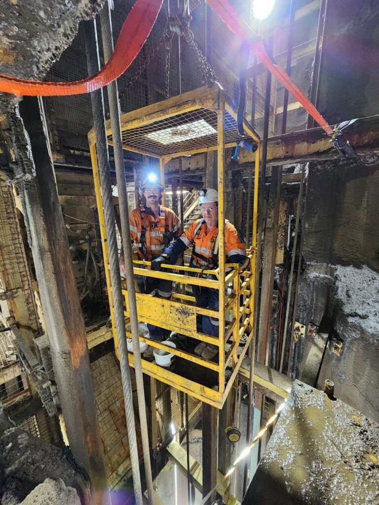 Men in lift in Underground mine shaft - Shaft Steel Replacement - Job Report 2024