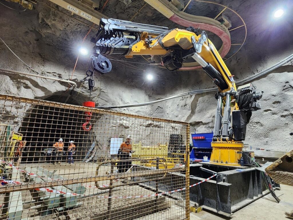 a yellow machine in a underground mine tunnel - Shaft Steel Replacement - Job Report 2024