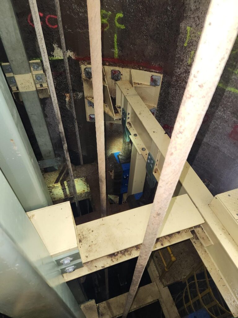 a metal bars in a mine shaft - Shaft Steel Replacement - Job Report 2024